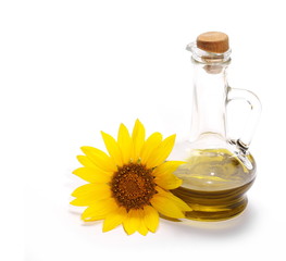 Sunflower and glass bottle of oil isolated on white background