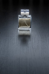 Perfume bottle with reflection on black background - 165596869
