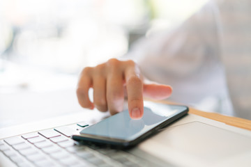 Business hand with mobile phone .