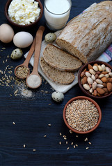 Healthy breakfast. Balanced diet, cooking, dieting, culinary and food concept. Different foodstuffs - whole grain bread, cereal,  cottage cheese, milk, egg, nut, yeast. Top view. Flat lay.