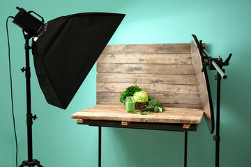 Professional equipment and vegetable juice in photo studio. Concept of food photography