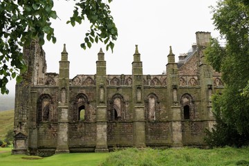 Fototapeta premium Holyrood Abbey is an Augustinian Abbey that lies in ruins in Edinburgh, Scotland. The Abbey (which is located on the grounds of the Palace of Holyrood, which preceded) was built in 1128 by order of Ki