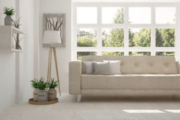 Inspiration of white room with sofa and green landscape in window. Scandinavian interior design. 3D illustration