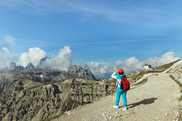 Woman on a background of dolomite Alps