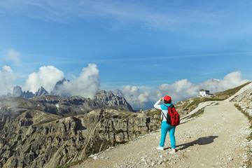 Fototapeta premium Woman on a background of dolomite Alps