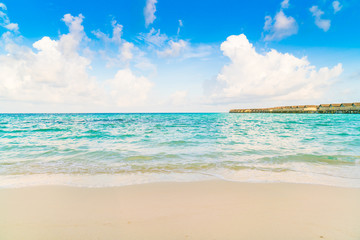 Beautiful water villas in tropical Maldives island at the sunrise time .
