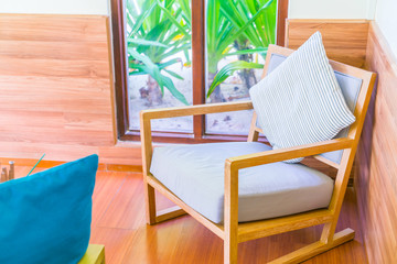 Closeup of modern furniture with pillows .