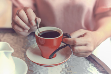 woman hands with cup of coffee.