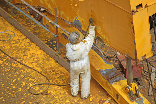 Paint stripping in a shipyard
