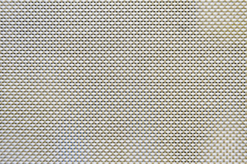 Close-up macro texture of winding curtain mesh
