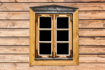 Vintage decorative window in wooden village house cottage.