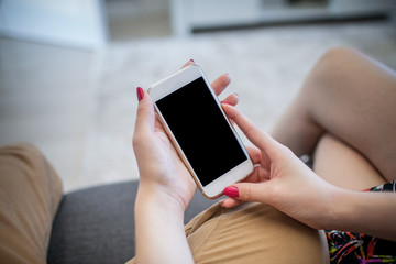 Young girl holding empty copy space mobile phone.