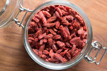 Dried goji berries in a glass jar