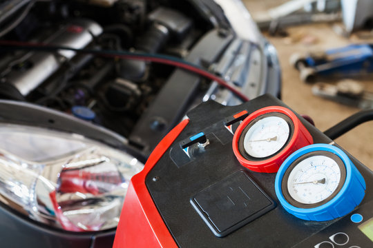 Refueling Of Car Conditioner In Auto Repair Shop