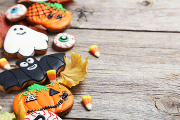 Fresh halloween gingerbread cookies on grey wooden table