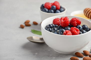Natural yogurt with fresh berries and honey, healthy breakfast concept, selective focus, copy space