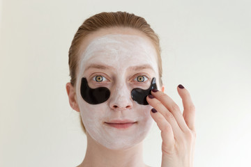 Portrait of ginger woman with black eye patches