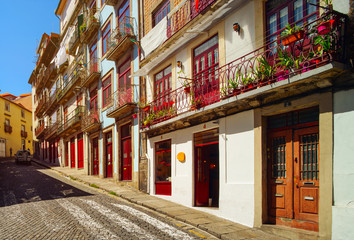 Fototapeta na wymiar Colorful decorated facades of traditional portugal street