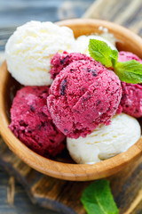 Homemade lemon and blackcurrant ice cream in a bowl.