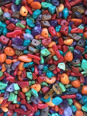 a pile of colorful stone beads