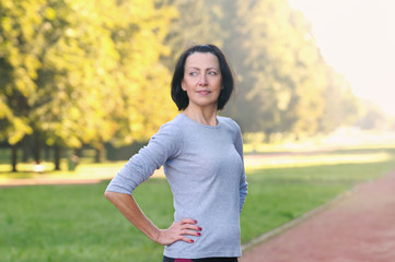 Portrait of mature woman before or after jog in the park