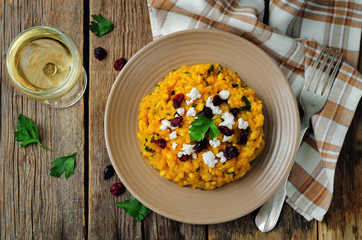 Pumpkin risotto with dried cranberries and goat cheese