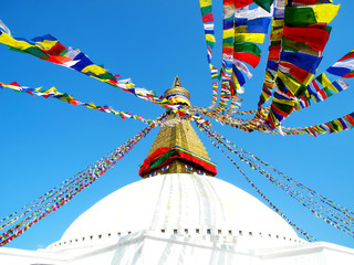 Close-up view of the Bodhnath Stupa with lunghta prayer flags waved in the wind, Kathmandu, Nepal.