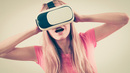 Girl wearing virtual reality goggles.
