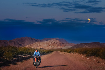 Woman cycling at night