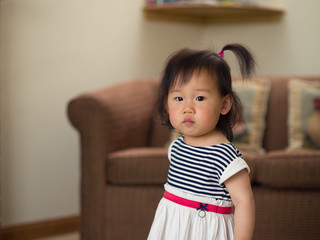 baby girl playing toy at home