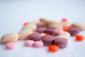 Close up of assorted colorful pills, tablets. Medicine background. Health care concept, vitamins. Soft colors