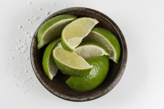 Lime Wedges in a Pottery Bowl