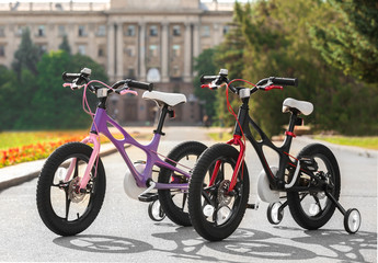 Modern children's bicycles outdoors on sunny day