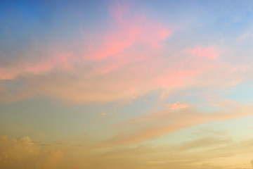 Beautiful abstract sky with pink and yellow clouds