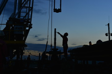 field oil workers at work