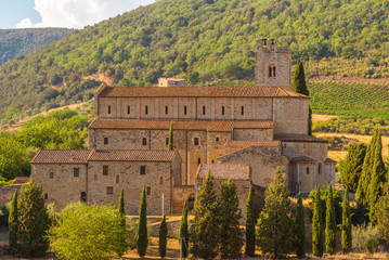 View of the ancient romanesque church of Sant'Antimo near Montalcino in Tuscany.
