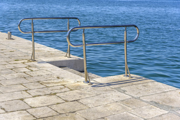 Metal ladder for descent into the water.