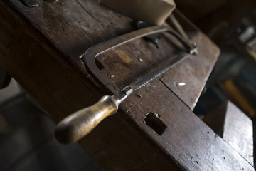 vintage workbench with an old saw