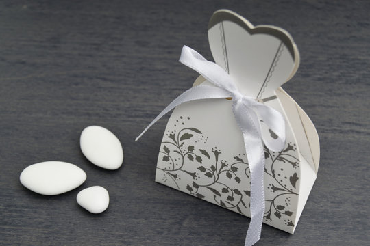 wedding dress shaped box with almond confetti inside