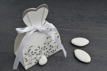 wedding dress shaped box with almond confetti inside