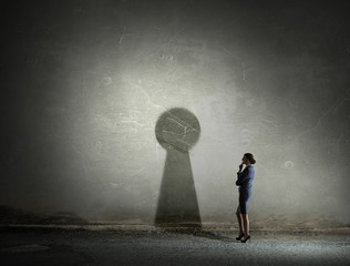 Obraz premium Businesswoman in empty room . Mixed media