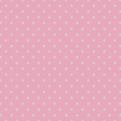 Seamless repeating polka dot spotty pattern with small white spots on a pale pastel pink background. © EmBaSy