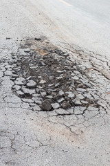 Background asphalt road surface crack.