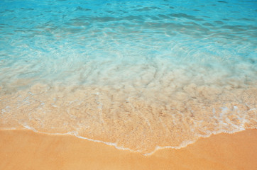 Fototapeta na wymiar soft wave at the sea and sandy beach in summer time