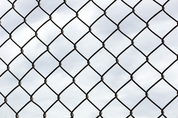 Bright Clouds through Chainlink The clouds are too bright to be stuck behind this chainlink fence today! They do look a lot more interesting this way, though. Great for a fence effect.