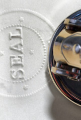 Antiforgery Seal: Official Notary or Corporate Original Document with Embossed Raised Seal 