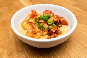 Shrimp and cheese grits with andouille sausage and green onions.