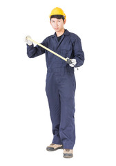 Young worker in unifrom with tape measure on white