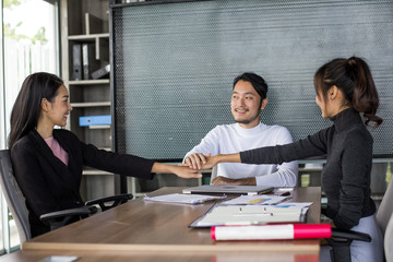 Asian people agree together for working project at office place, people woking concept.