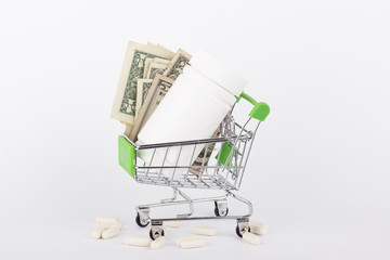 American dollars in the shopping pushcart, isolated